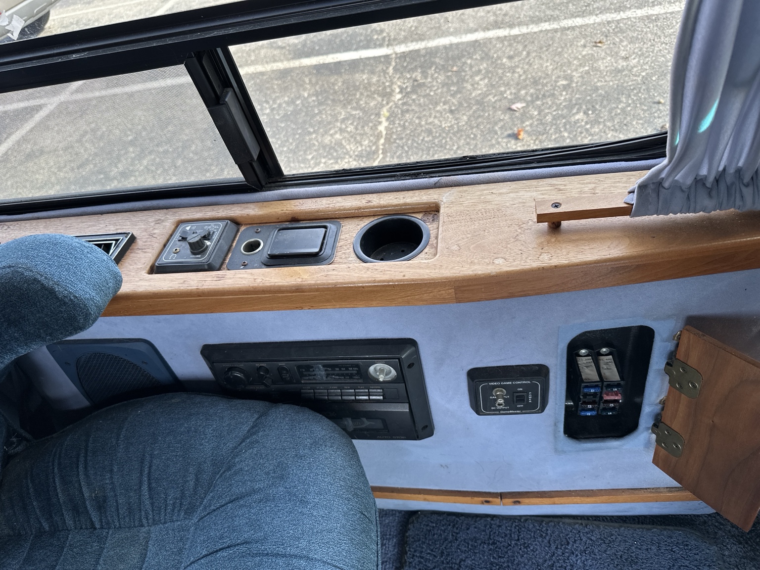 Actual Elk interior showing side window, rear radio and conversion fuse panel